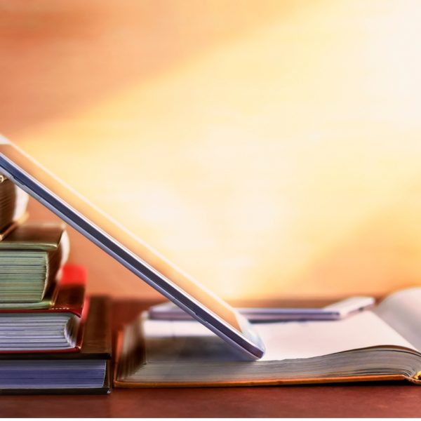 open-textbook-and-notepad-on-the-table-the-concept-of-combining-in-picture-id1043113682